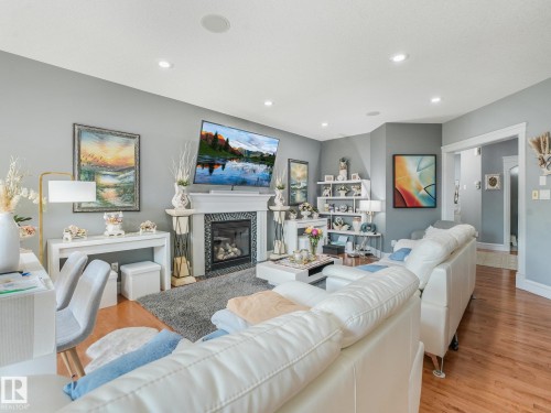 544 Adams Way Sw, Edmonton, AB - Indoor Photo Showing Living Room With Fireplace