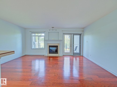 #3 10 Woodcrest Ln, Fort Saskatchewan, AB - Indoor Photo Showing Living Room With Fireplace