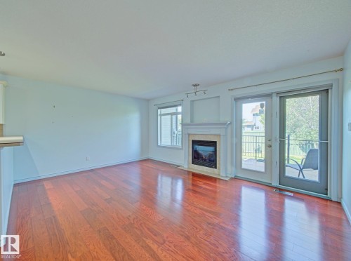 #3 10 Woodcrest Ln, Fort Saskatchewan, AB - Indoor Photo Showing Living Room With Fireplace