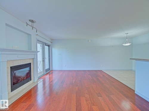 #3 10 Woodcrest Ln, Fort Saskatchewan, AB - Indoor Photo Showing Living Room With Fireplace