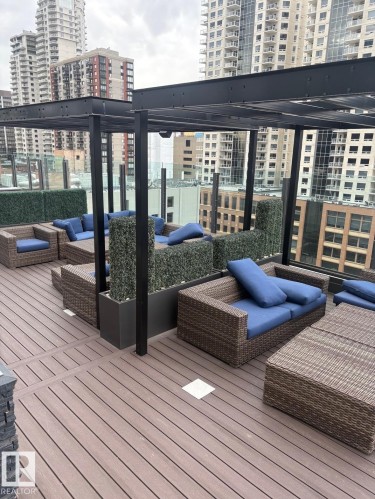 Located on the 10th floor, this rooftop deck features lounging seating, BBQ area and hottub. - #2804 10238 103 St Nw, Edmonton, AB - Outdoor With Deck Patio Veranda