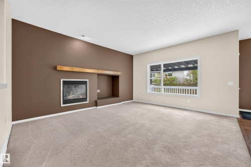 1605 Hodgson Court Nw, Edmonton, AB - Indoor Photo Showing Living Room With Fireplace