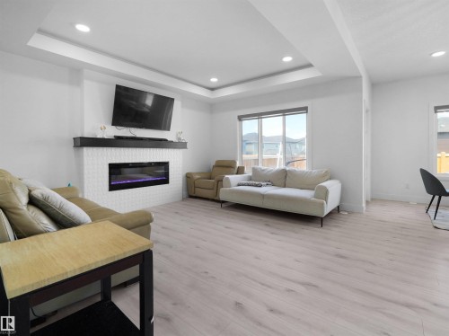 2520 12 Avenue Nw, Edmonton, AB - Indoor Photo Showing Living Room With Fireplace