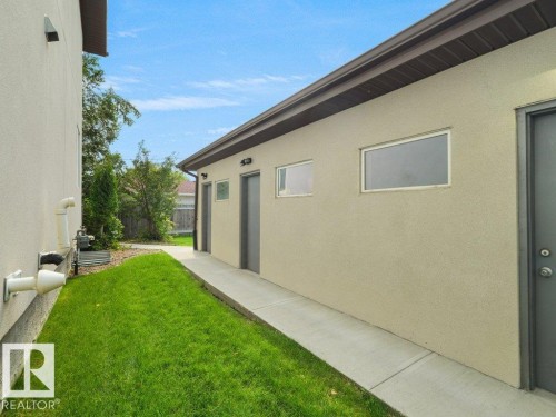 Exterior stucco finish with modern rectangular windows - 7909 105 Avenue Nw, Edmonton, AB - Outdoor With Exterior