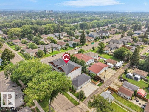 Aerial perspective of a multi-story property with a dark shingle roof - 7909 105 Avenue Nw, Edmonton, AB - Outdoor With View