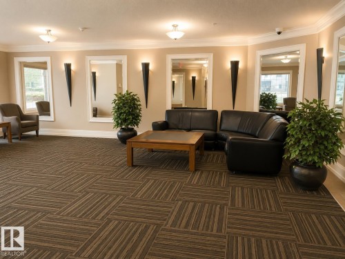 Lobby area featuring patterned carpet flooring, recessed lighting, and wall-mounted sconces - #202 16715 100 Av Nw, Edmonton, AB - Indoor