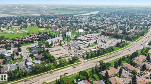 Expansive aerial perspective showcasing a residential district with a distinct commercial hub - #39 3111 142 Av Nw, Edmonton, AB - Outdoor With View