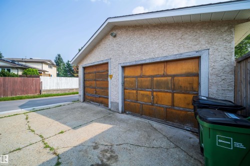 Detached garage featuring stucco siding and two overhead doors - 1719 37 Street Nw, Edmonton, AB - Outdoor