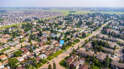 Expansive aerial perspective showcasing a residential neighborhood with mature trees - 1719 37 Street Nw, Edmonton, AB - Outdoor With View
