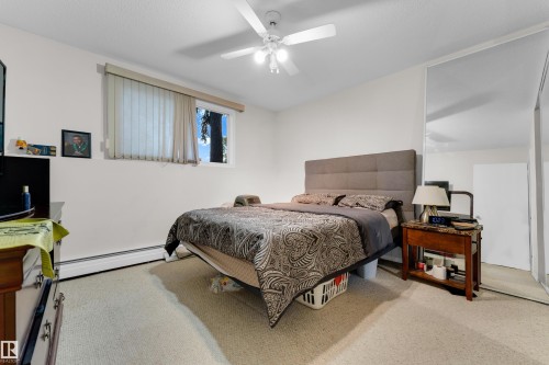 Bedroom featuring neutral carpeting and white walls - #104 11445 41 Av Nw, Edmonton, AB - Indoor Photo Showing Bedroom