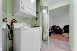 Dedicated laundry area featuring a stacked washer and dryer unit - 