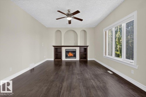 2836 34A Avenue Nw, Edmonton, AB - Indoor Photo Showing Living Room With Fireplace
