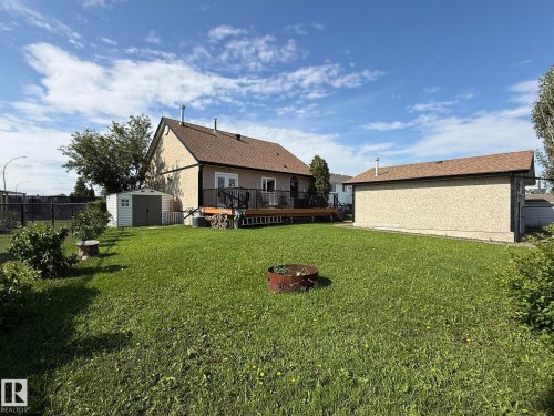 Expansive backyard with a large deck and detached garage - 4508 57 Avenue, Lamont, AB - Outdoor With Deck Patio Veranda