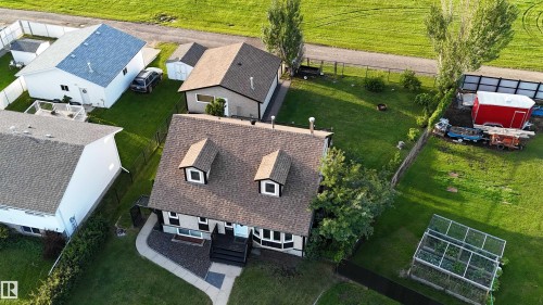 Aerial view showcasing a property with a spacious backyard and green space - 4508 57 Avenue, Lamont, AB - Outdoor