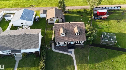 Aerial perspective showcasing the property's expansive green lawn - 4508 57 Avenue, Lamont, AB - Outdoor