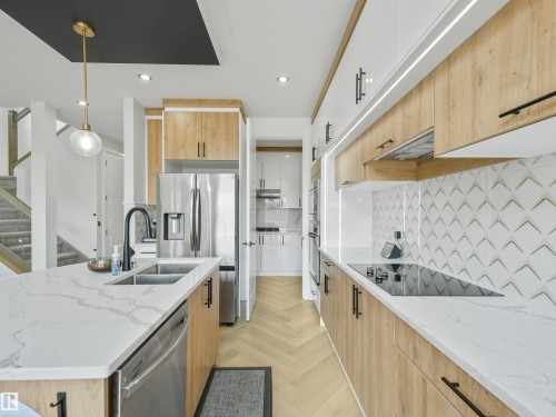 4621 170A Avenue Nw, Edmonton, AB - Indoor Photo Showing Kitchen With Stainless Steel Kitchen With Double Sink With Upgraded Kitchen