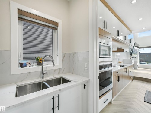 4621 170A Avenue Nw, Edmonton, AB - Indoor Photo Showing Kitchen With Double Sink