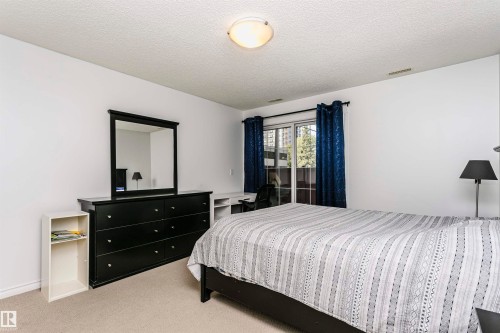 Room featuring light-colored carpeting and white painted walls - #106 12110 106 Av Nw, Edmonton, AB - Indoor Photo Showing Bedroom
