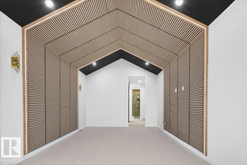 Architectural wood-slat wall feature with integrated lighting - 427 172 Avenue Nw, Edmonton, AB -  Photo Showing Other Room