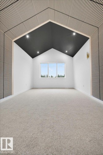 Vaulted ceiling with dark accent paint and recessed lighting - 427 172 Avenue Nw, Edmonton, AB - Indoor Photo Showing Other Room