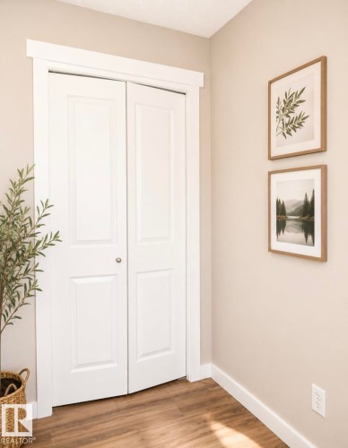 White paneled bi-fold doors framed with substantial trim - 5135 1A Avenue Sw, Edmonton, AB - Indoor Photo Showing Other Room