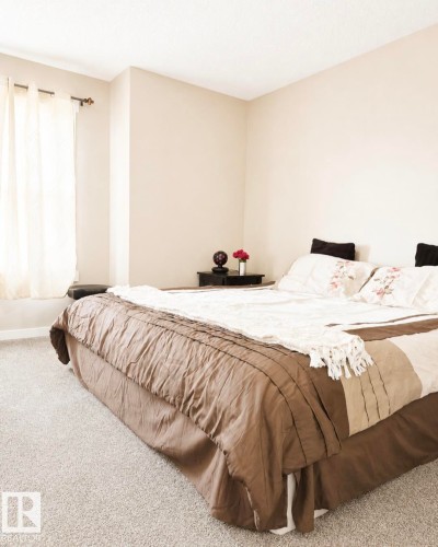 Carpeted room with a window featuring sheer drapery - 5135 1A Avenue Sw, Edmonton, AB - Indoor Photo Showing Bedroom