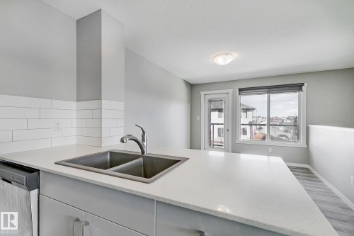 #20 1530 Tamarack Boulevard Nw, Edmonton, AB - Indoor Photo Showing Kitchen With Double Sink