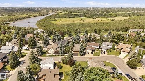 Residential neighborhood with mature trees, established homes, and a river backdrop - 4108 Ramsay Road Nw, Edmonton, AB - Outdoor With View