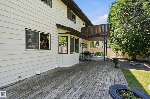 Expansive wooden deck with a multi-level design and an upper-level balcony - 4108 Ramsay Road Nw, Edmonton, AB - Outdoor With Deck Patio Veranda With Exterior
