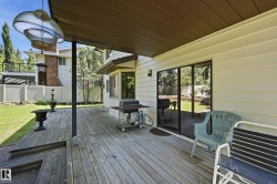 Expansive wood deck with covered patio area - 