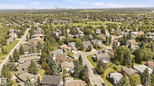 Aerial perspective showcasing a residential area with mature trees and varied architectural styles - 4108 Ramsay Road Nw, Edmonton, AB - Outdoor With View