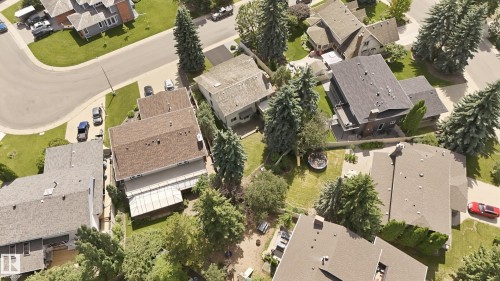 Aerial perspective showcasing a residential neighborhood with varied architectural styles - 4108 Ramsay Road Nw, Edmonton, AB - Outdoor With View