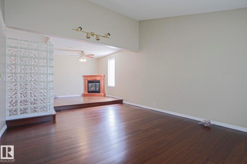 4309 42 Street, Leduc, AB - Indoor Photo Showing Other Room With Fireplace
