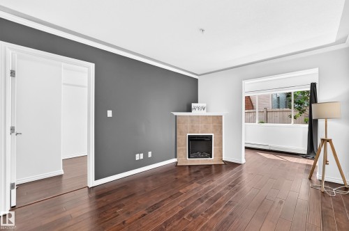 #105 9938 104 St Nw, Edmonton, AB - Indoor With Fireplace