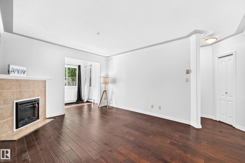 #105 9938 104 St Nw, Edmonton, AB - Indoor With Fireplace