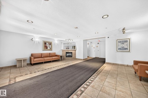 #105 9938 104 St Nw, Edmonton, AB - Indoor With Fireplace