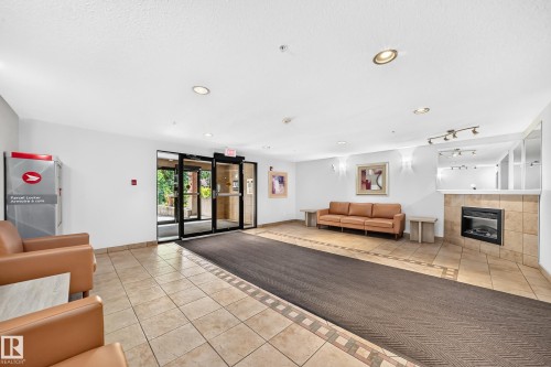 #105 9938 104 St Nw, Edmonton, AB - Indoor With Fireplace