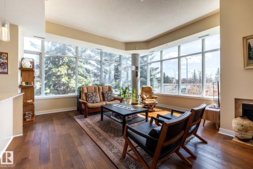 #S113 2504 109 St Nw, Edmonton, AB - Indoor Photo Showing Living Room With Fireplace