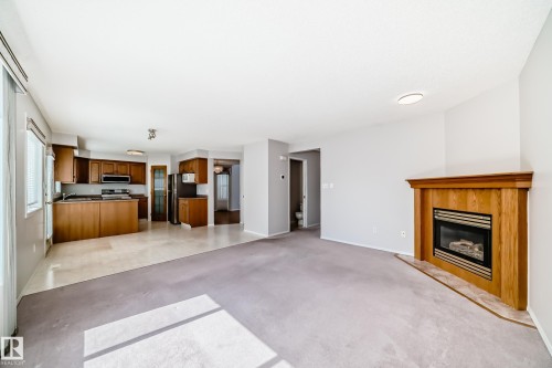 4319 39 Avenue Nw, Edmonton, AB - Indoor Photo Showing Living Room With Fireplace