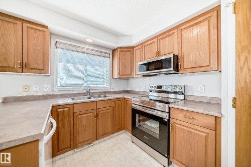 4319 39 Avenue Nw, Edmonton, AB - Indoor Photo Showing Kitchen With Double Sink