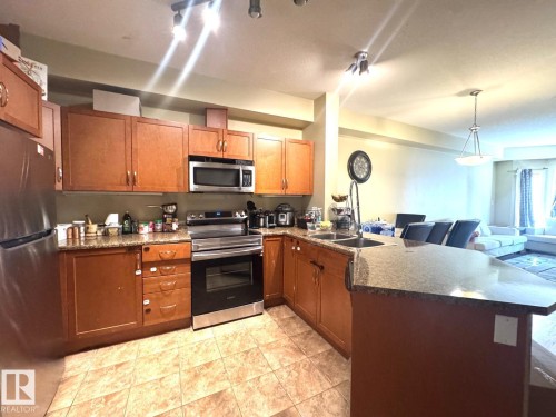 #117 4304 139 Av Nw, Edmonton, AB - Indoor Photo Showing Kitchen With Double Sink