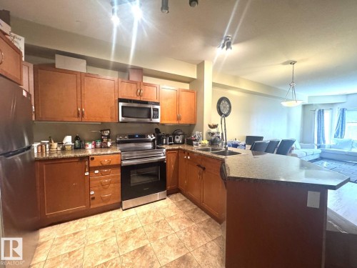 #117 4304 139 Av Nw, Edmonton, AB - Indoor Photo Showing Kitchen With Double Sink