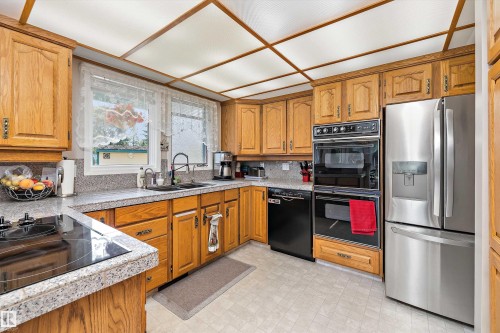 45 Blue Quill Crescent Nw, Edmonton, AB - Indoor Photo Showing Kitchen With Double Sink