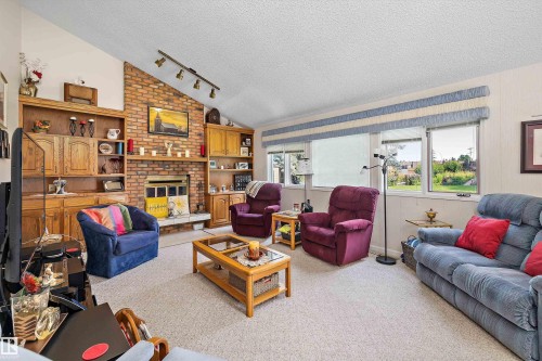 45 Blue Quill Crescent Nw, Edmonton, AB - Indoor Photo Showing Living Room With Fireplace