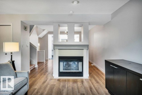 9321 98 Avenue Nw, Edmonton, AB - Indoor Photo Showing Living Room With Fireplace