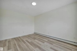 Neutral-toned walls complement wood-finish flooring - 