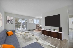 Living area featuring wood-finish flooring, a built-in media console with dark wood-finish doors, and a balcony with a black metal railing - 