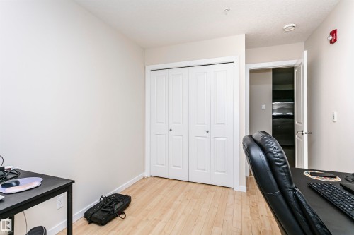 Neutral wall colors with light wood-finish flooring - #104 9519 160 Av Nw, Edmonton, AB - Indoor