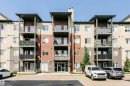 Modern multi-story building featuring a facade of horizontal siding in varying earth tones - #104 9519 160 Av Nw, Edmonton, AB 