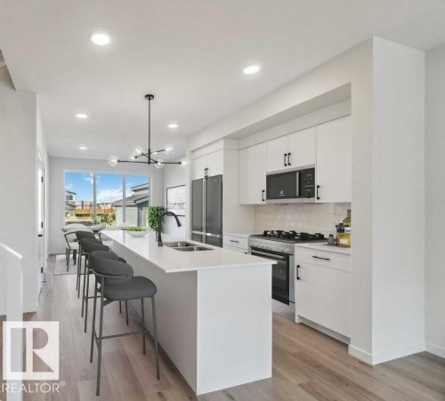 7126 50A Avenue, Beaumont, AB - Indoor Photo Showing Kitchen With Stainless Steel Kitchen With Double Sink With Upgraded Kitchen